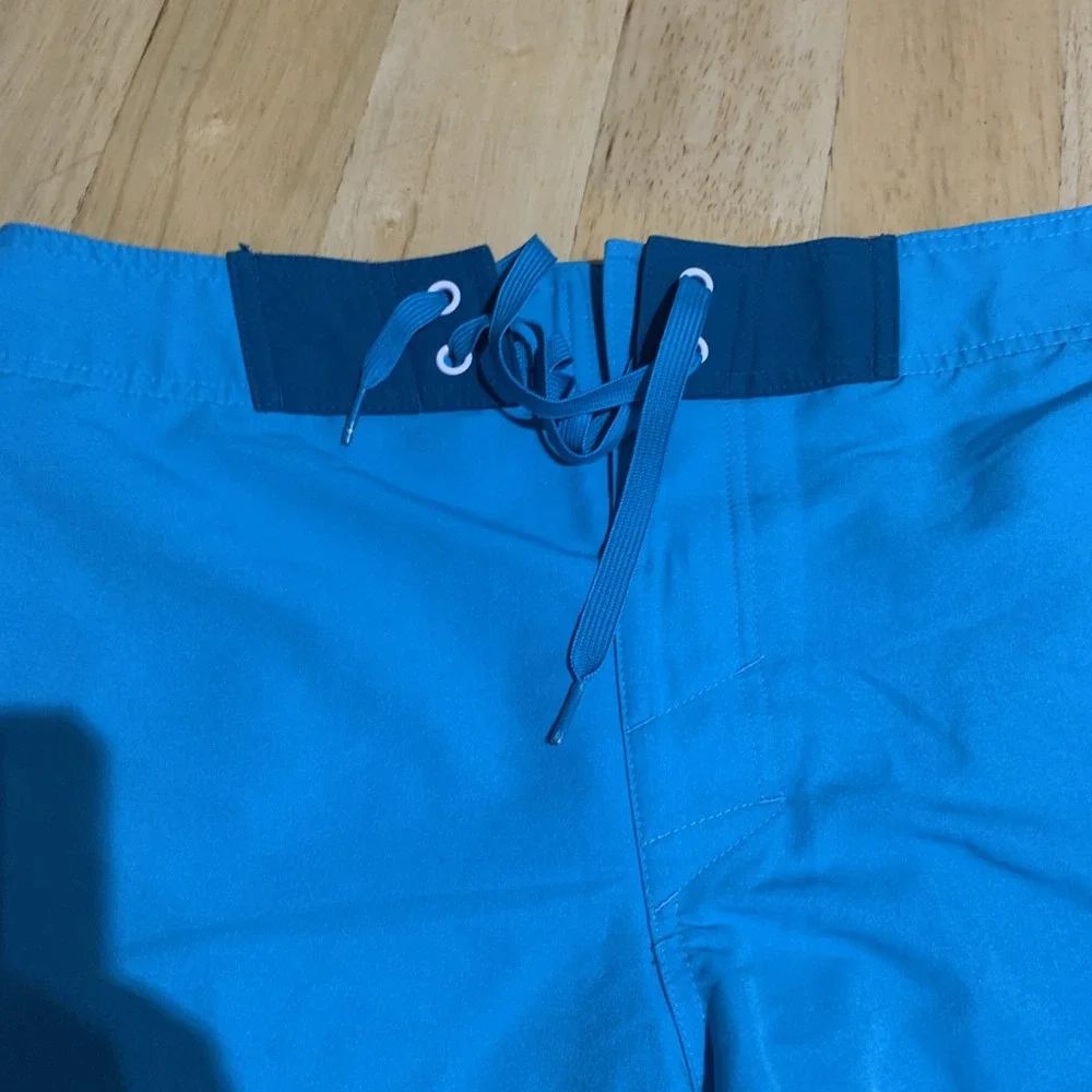 Under Armour Swim Trunks Men s 32 Teal Loose Heatgear Flap Pocket Beach Swimming
